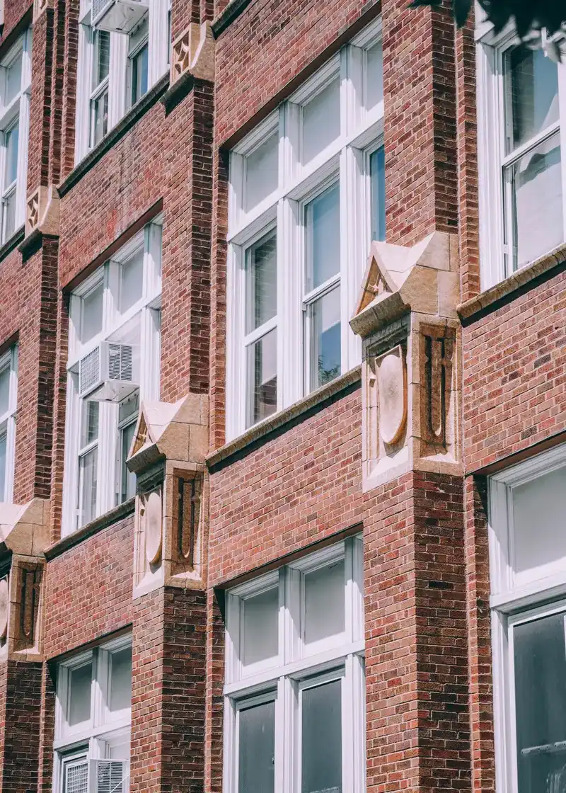 Historic red brick and limestone facade of a vintage Chicago residential building